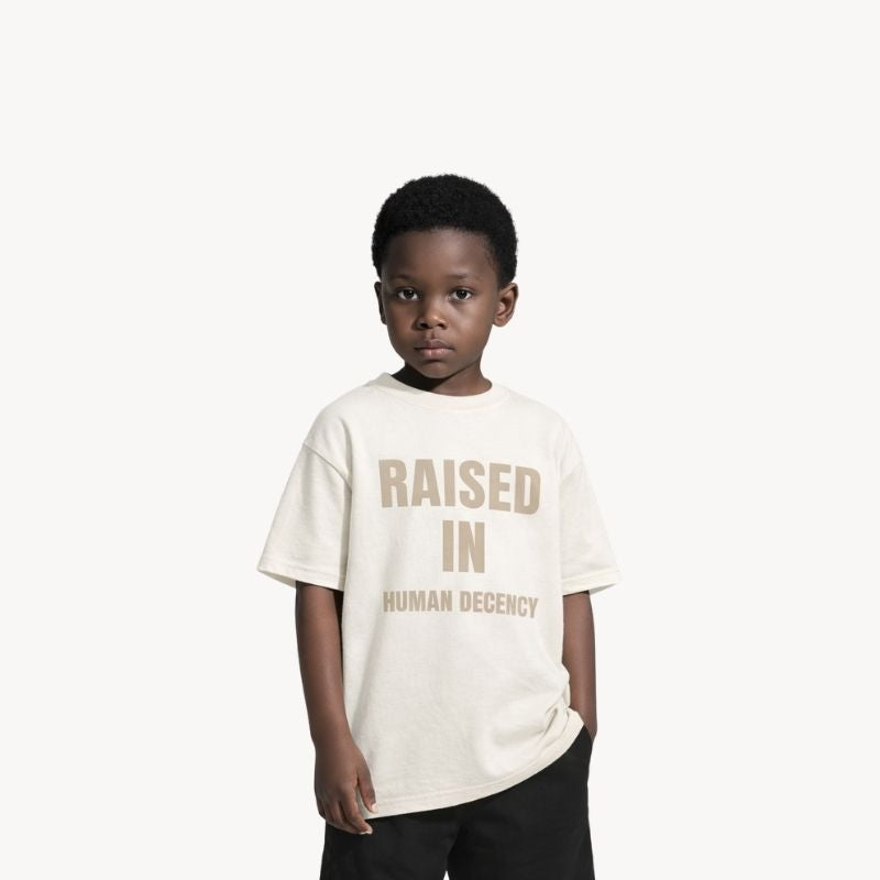RAISED IN HUMAN DECENCY – Kids T-shirt
